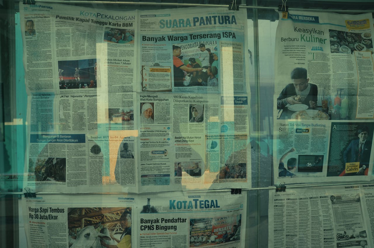 about-img Detailed view of various newspapers on display in Jakarta, Indonesia.