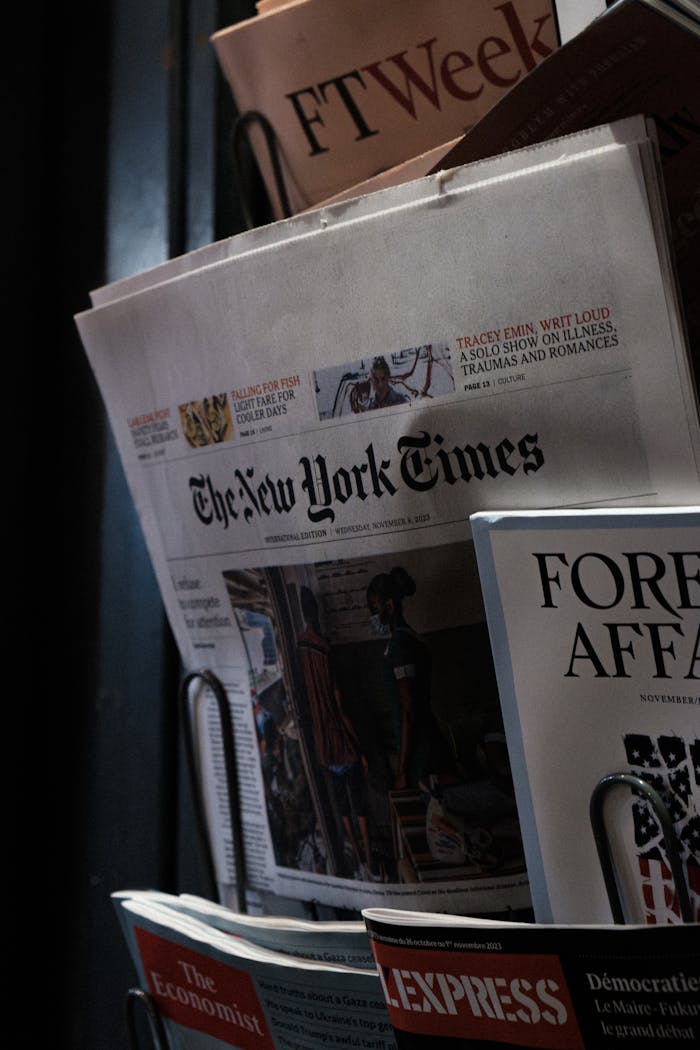 about-02 A detailed look at a newspaper stand showcasing The New York Times and other publications.